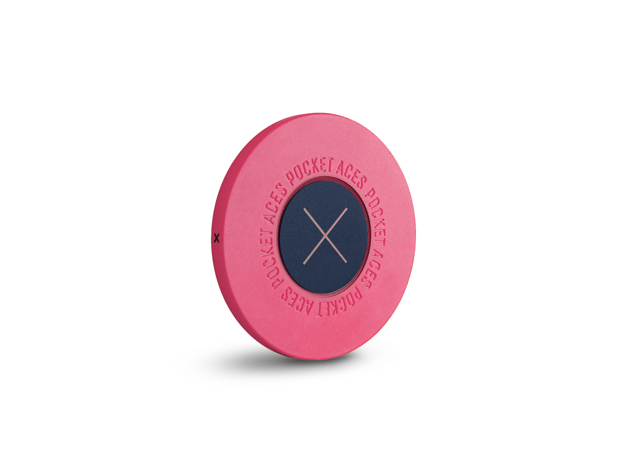 A pink colored poker chip standing on it's edge