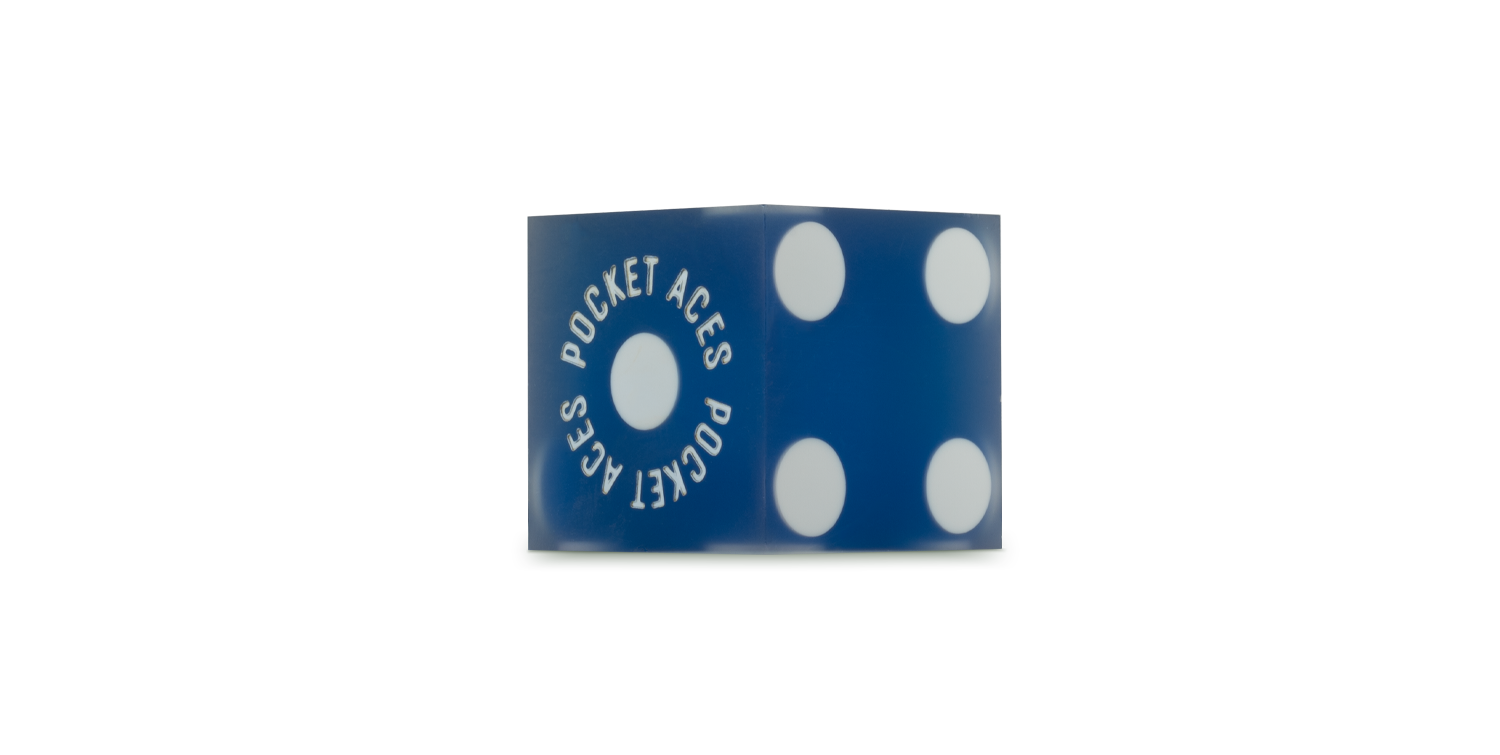 A sanded casino die in an ocean color
