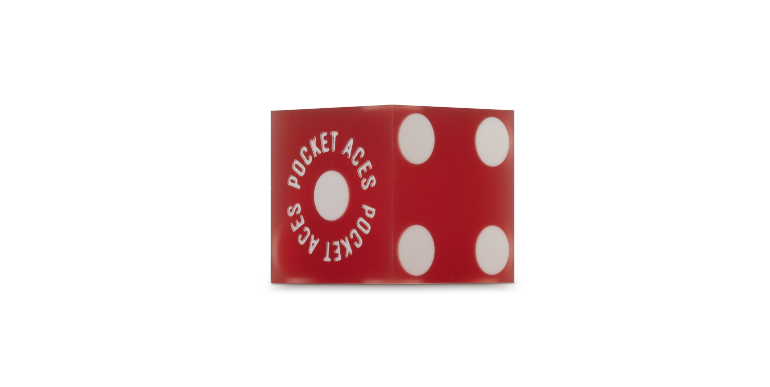 A sanded casino die in a pomegranate color
