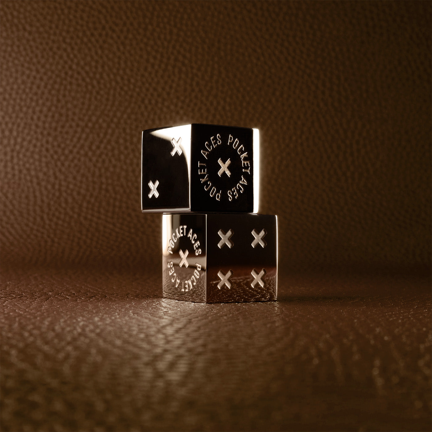 A set of polished stainless steel dice