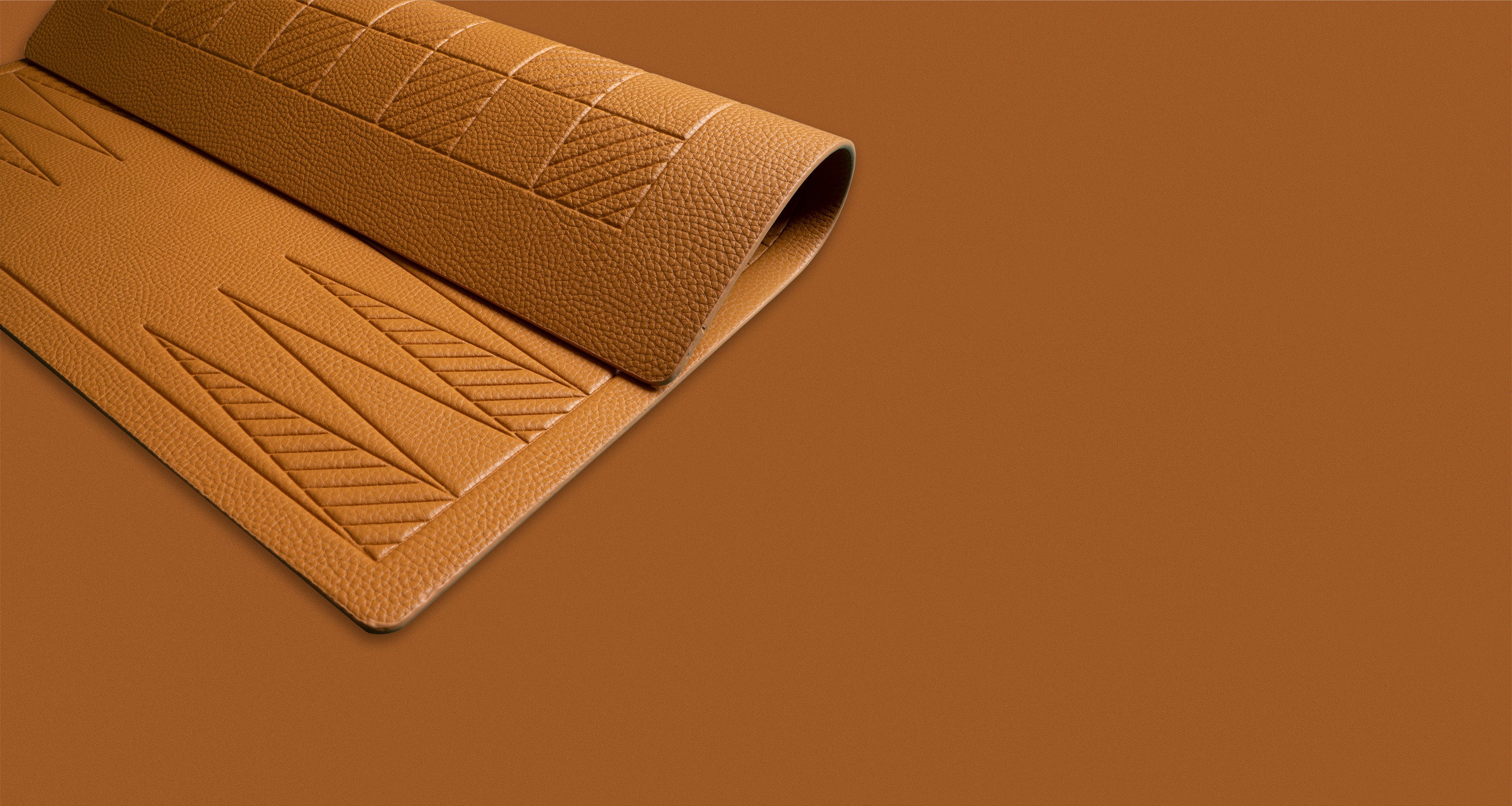 A flexible backgammon and checkers board in a camel color