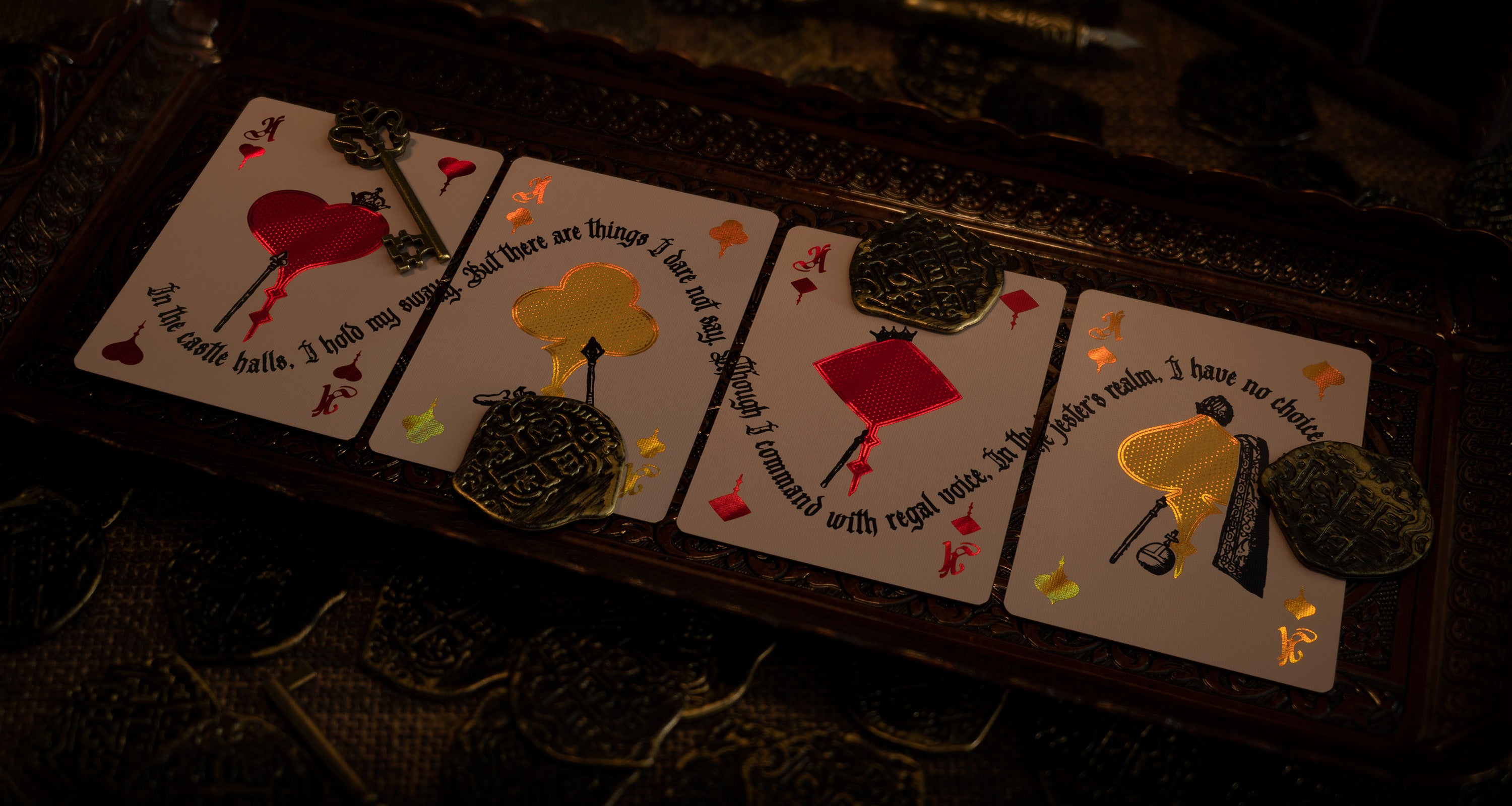Four ace cards on an ornate medieval tray