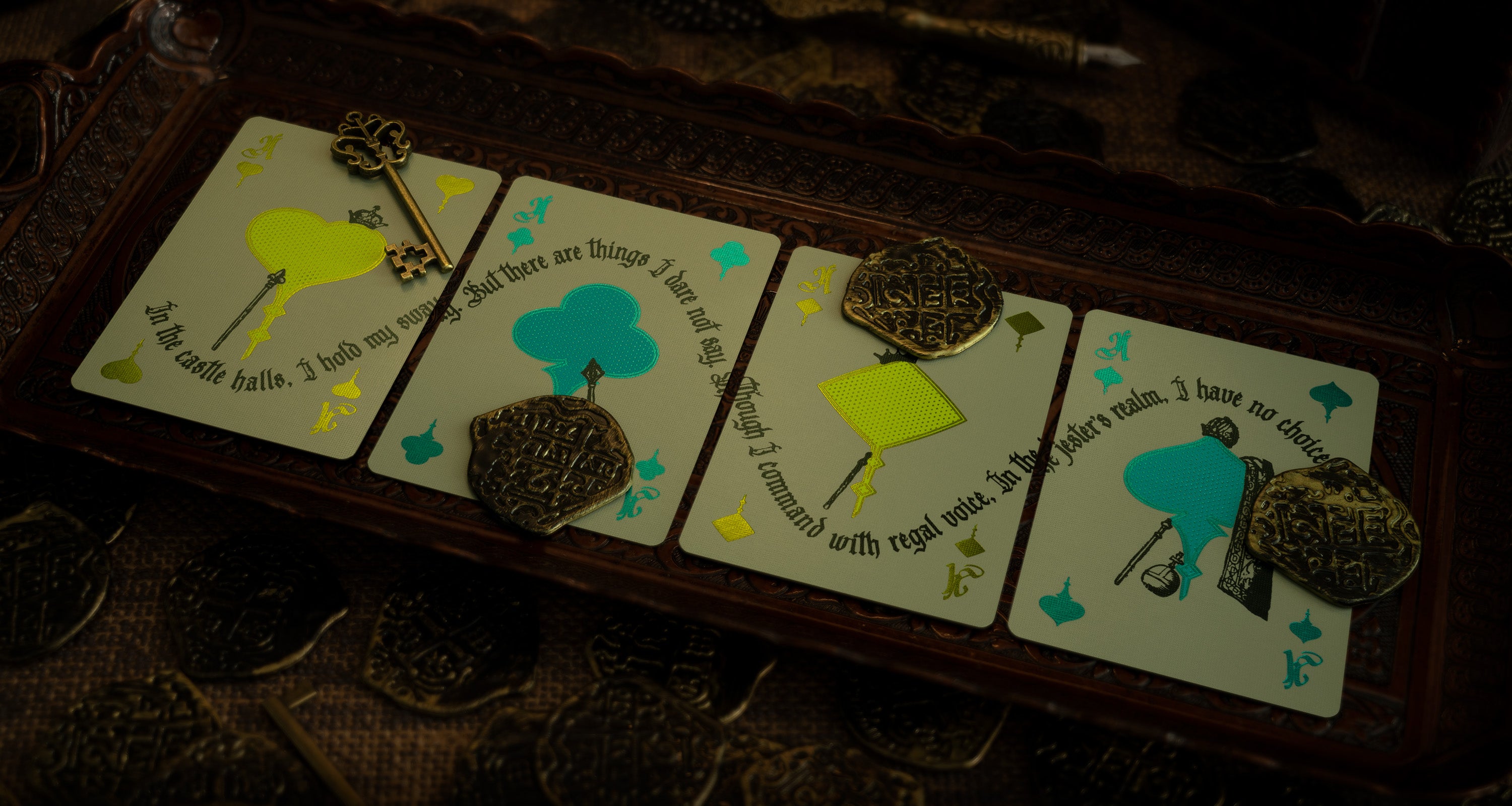 Four ace cards on an ornate medieval tray