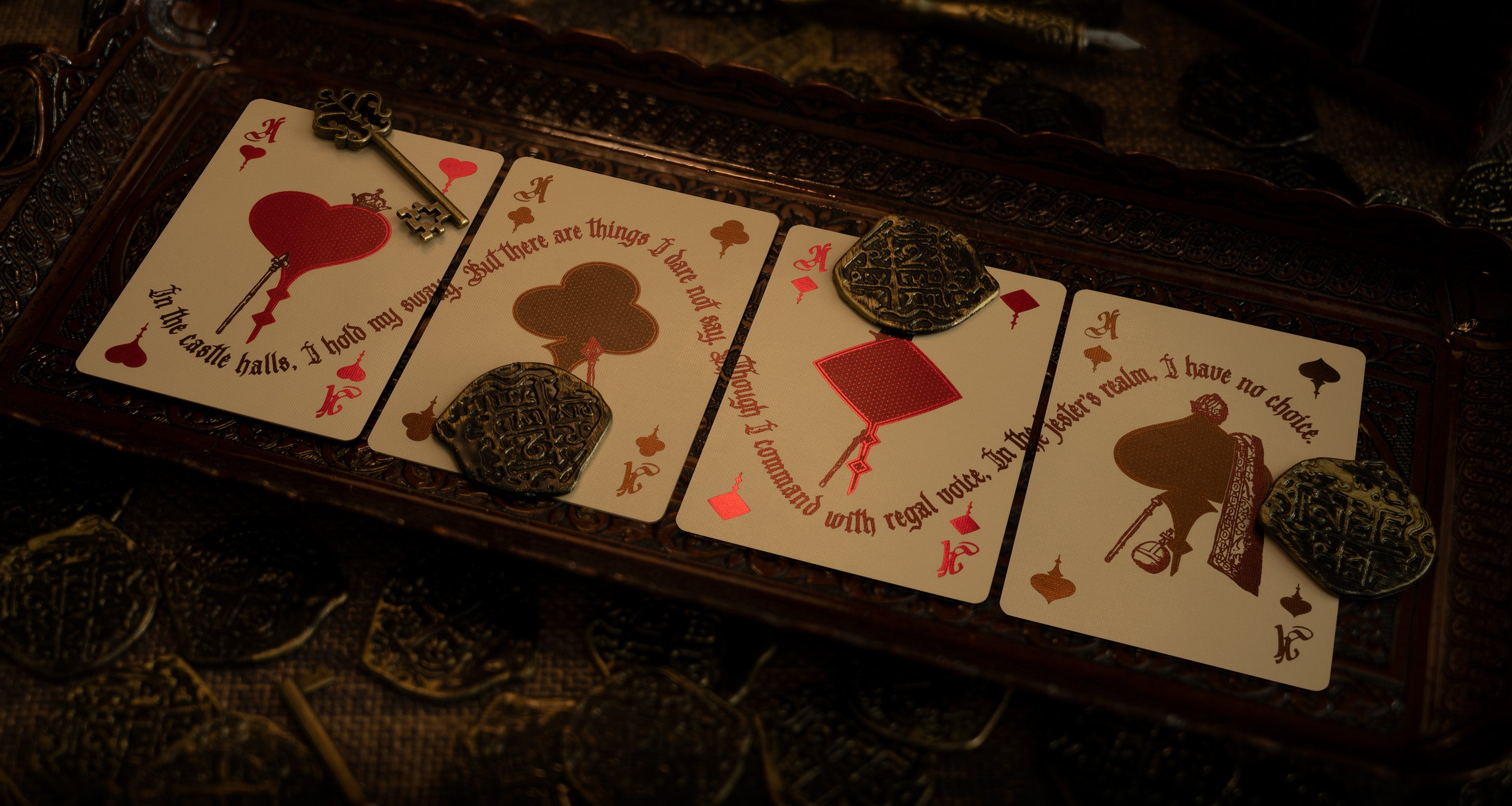 Four ace cards on an ornate medieval tray