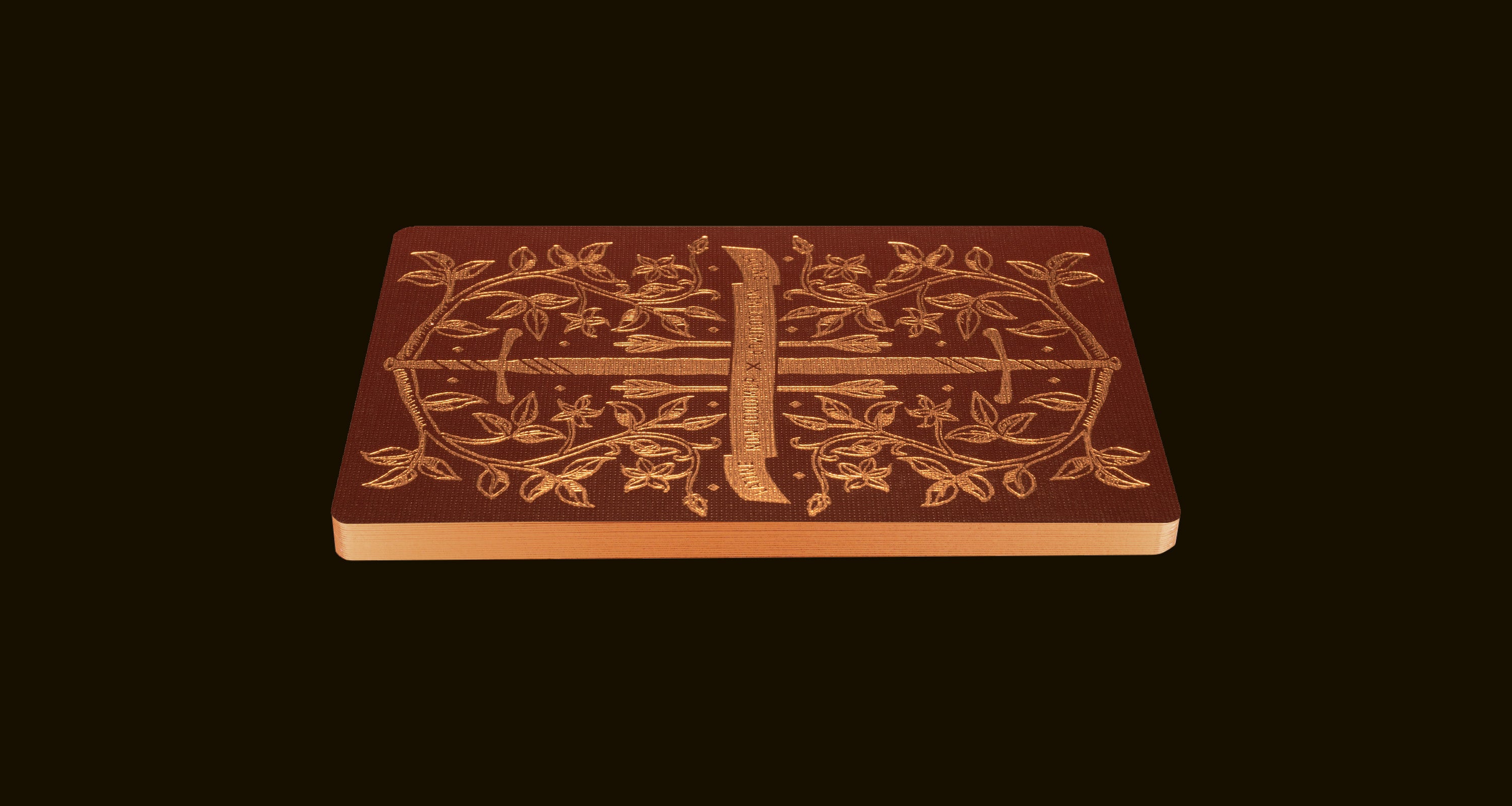 A red playing card back on a dark brown background