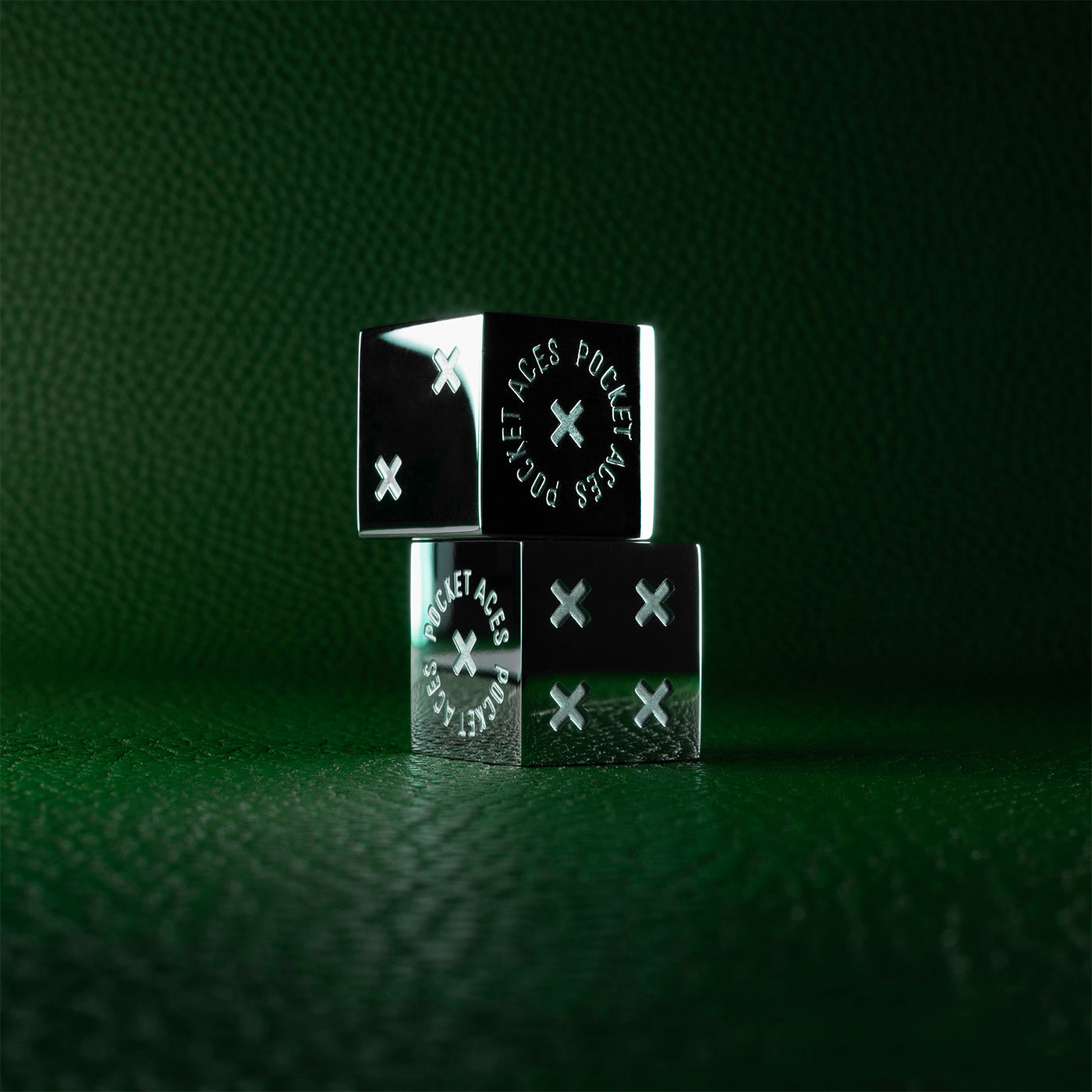 A set of polished stainless steel dice