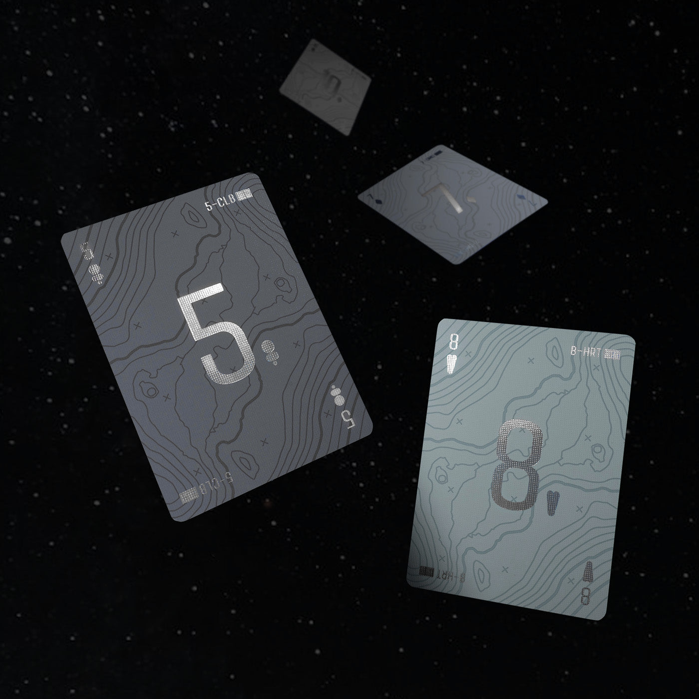 Four playing cards floating in space