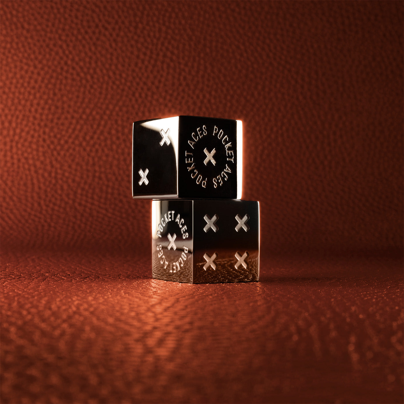 A set of polished stainless steel dice
