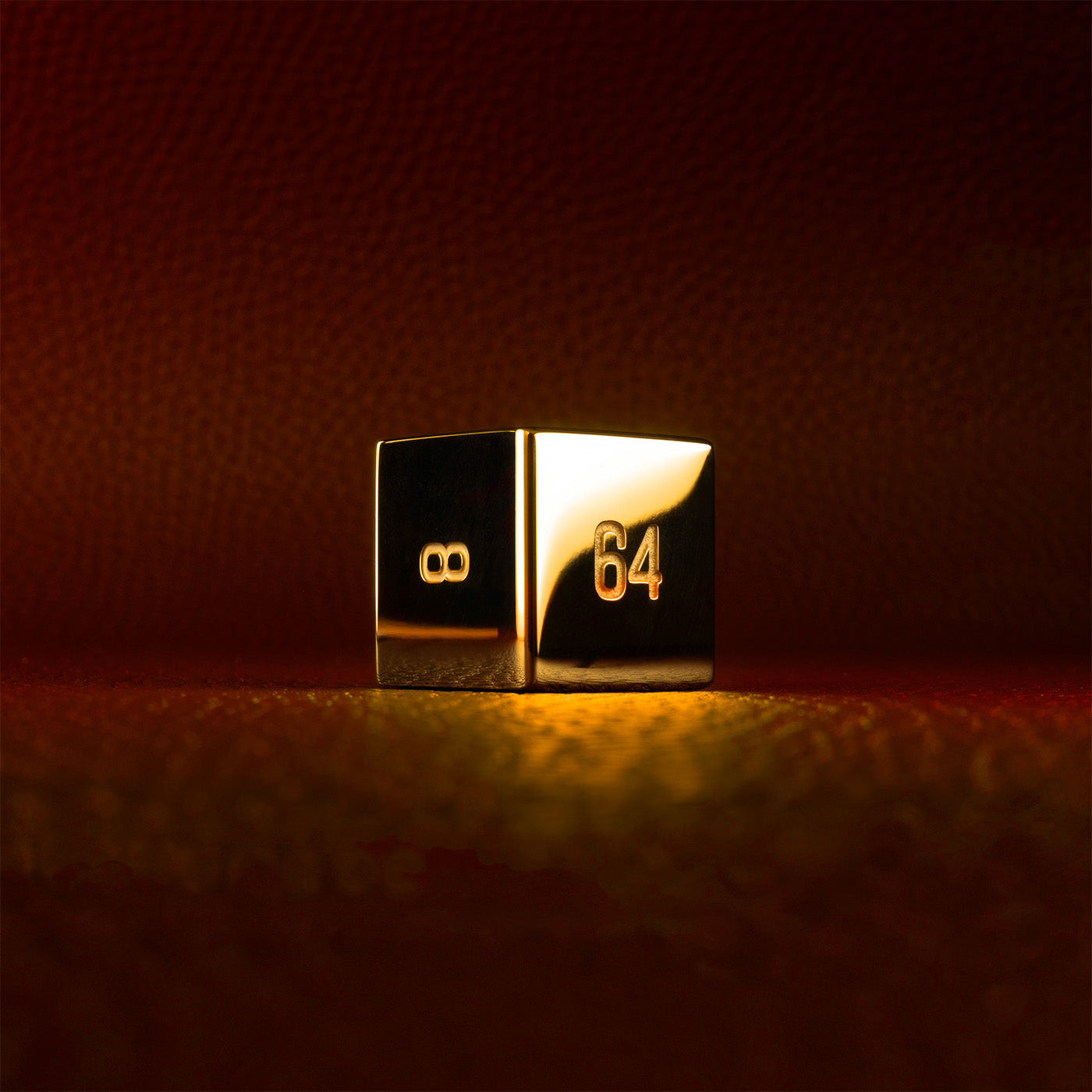 A polished gold doubling cube