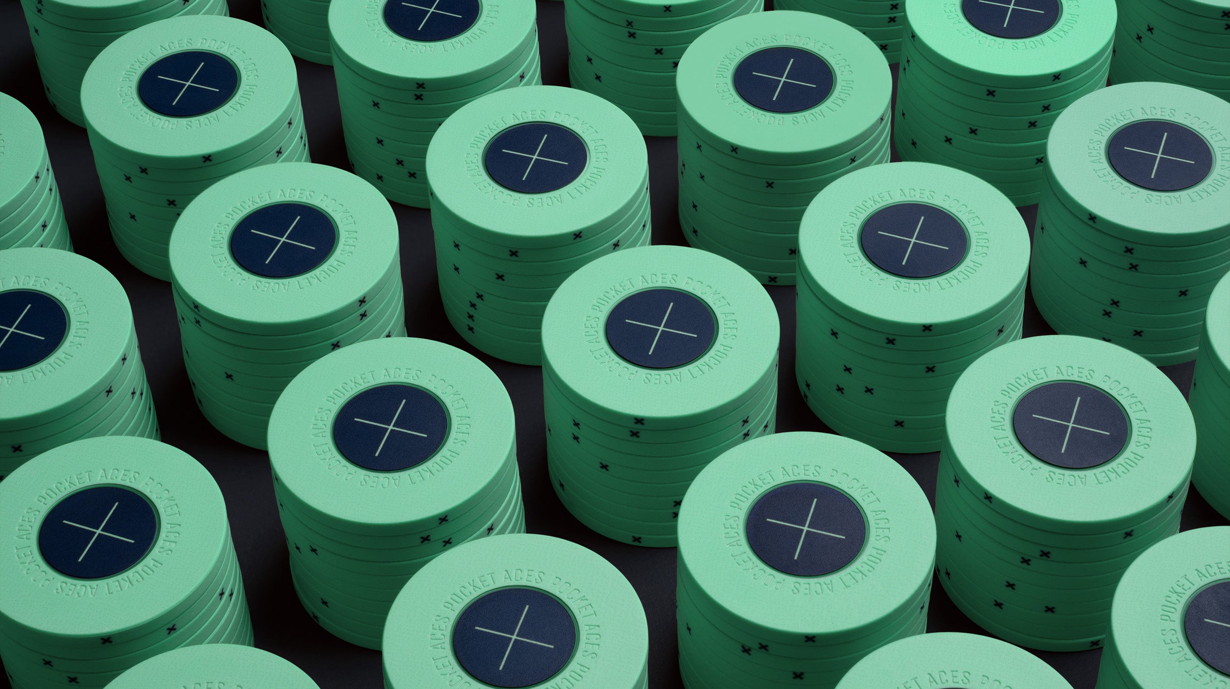 Rows of mint colored poker chips on a table
