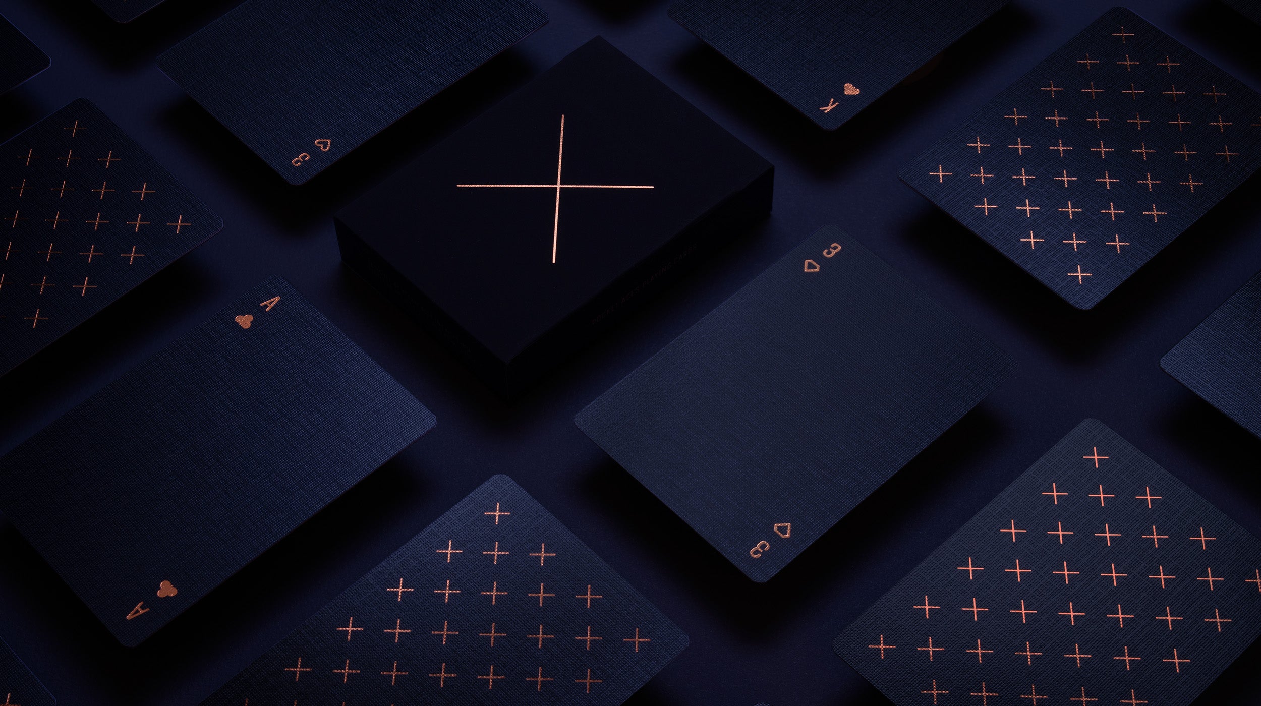 A navy and copper deck of cards on a table