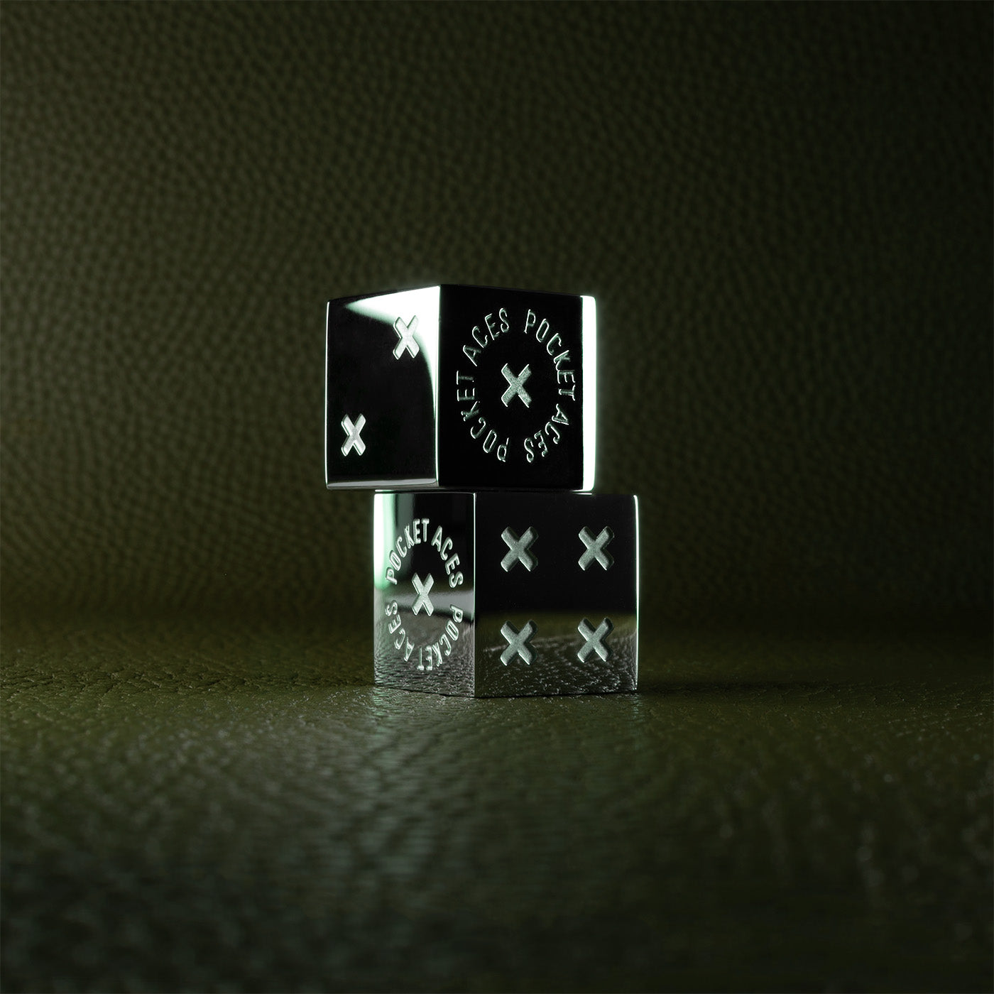 A set of polished stainless steel dice