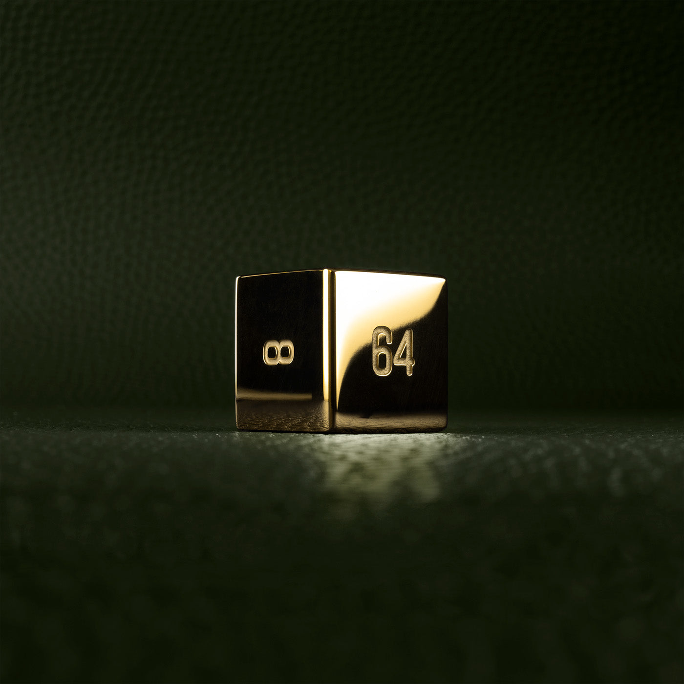 A polished gold doubling cube