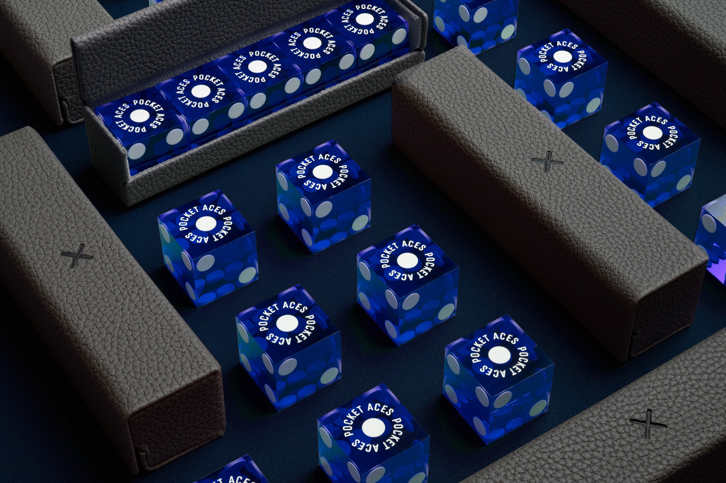 A set of casino style dice and cases arranged on a table