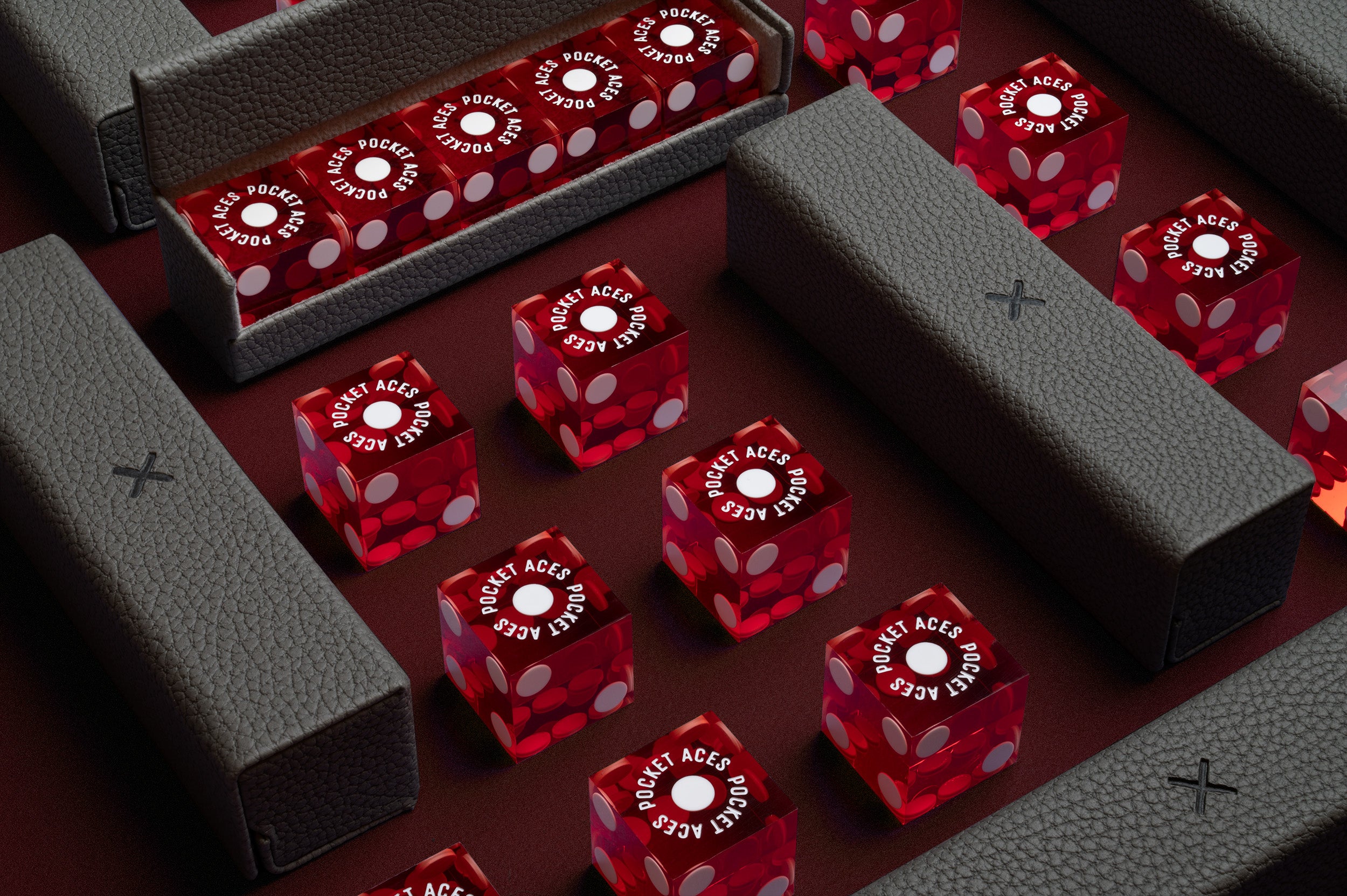 A set of casino style dice and cases arranged on a table