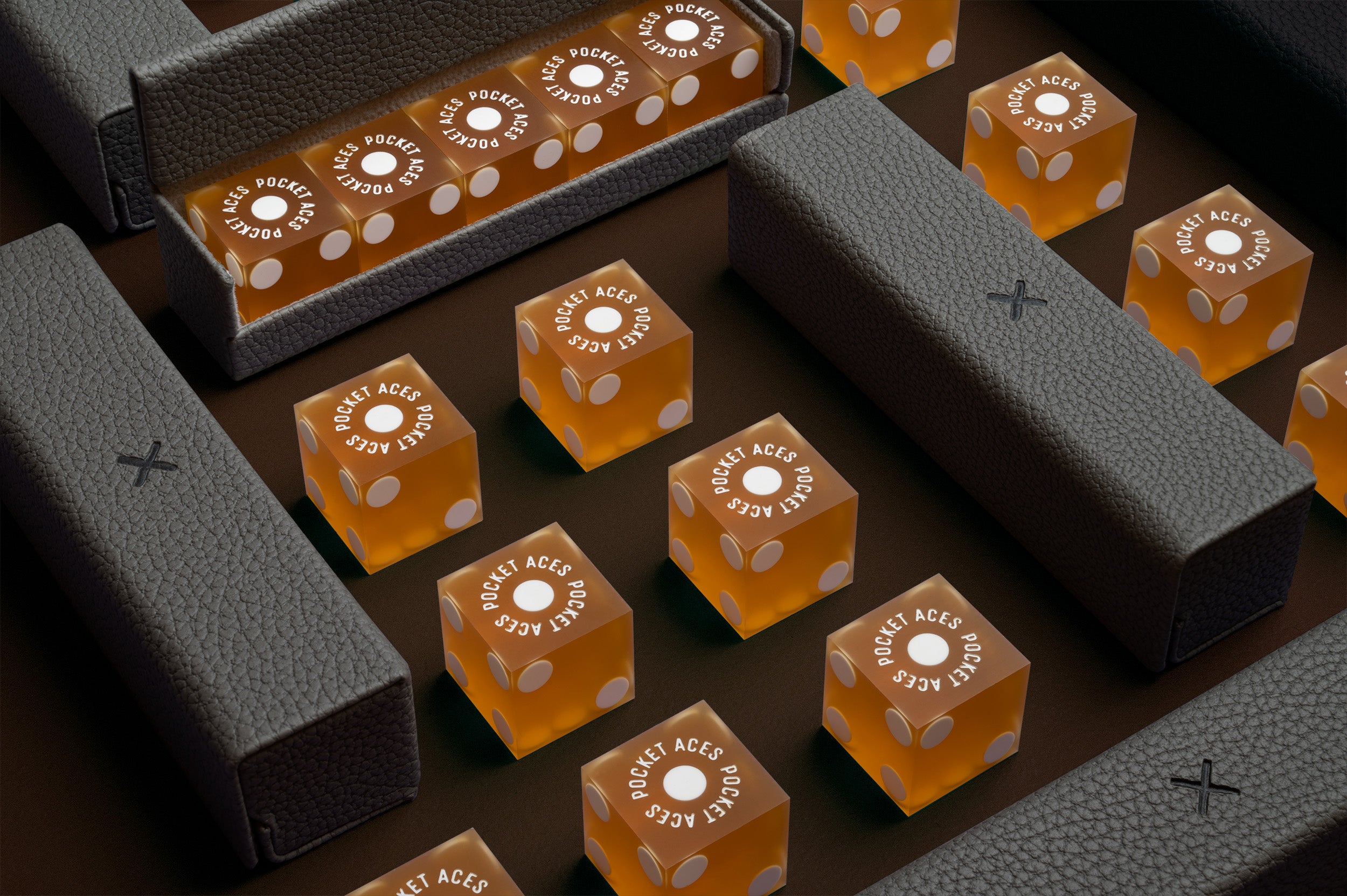 A set of casino style dice and cases arranged on a table