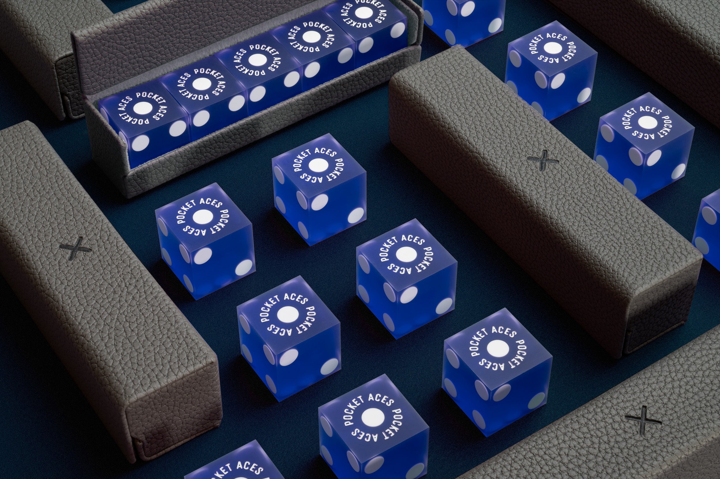 A set of casino style dice and cases arranged on a table