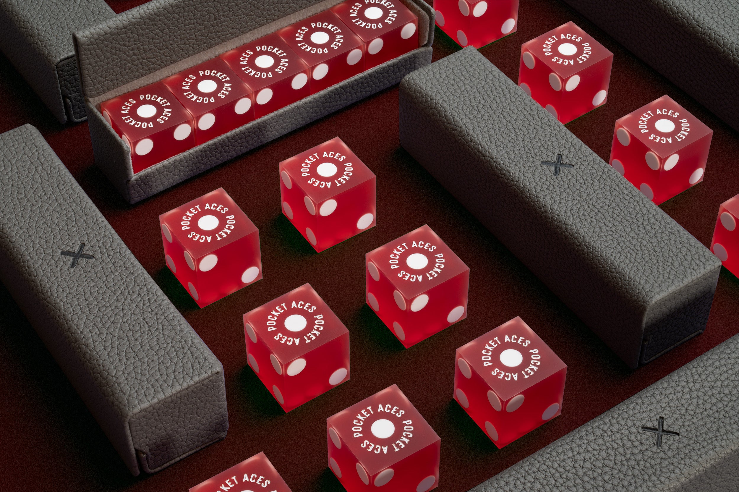 A set of casino style dice and cases arranged on a table