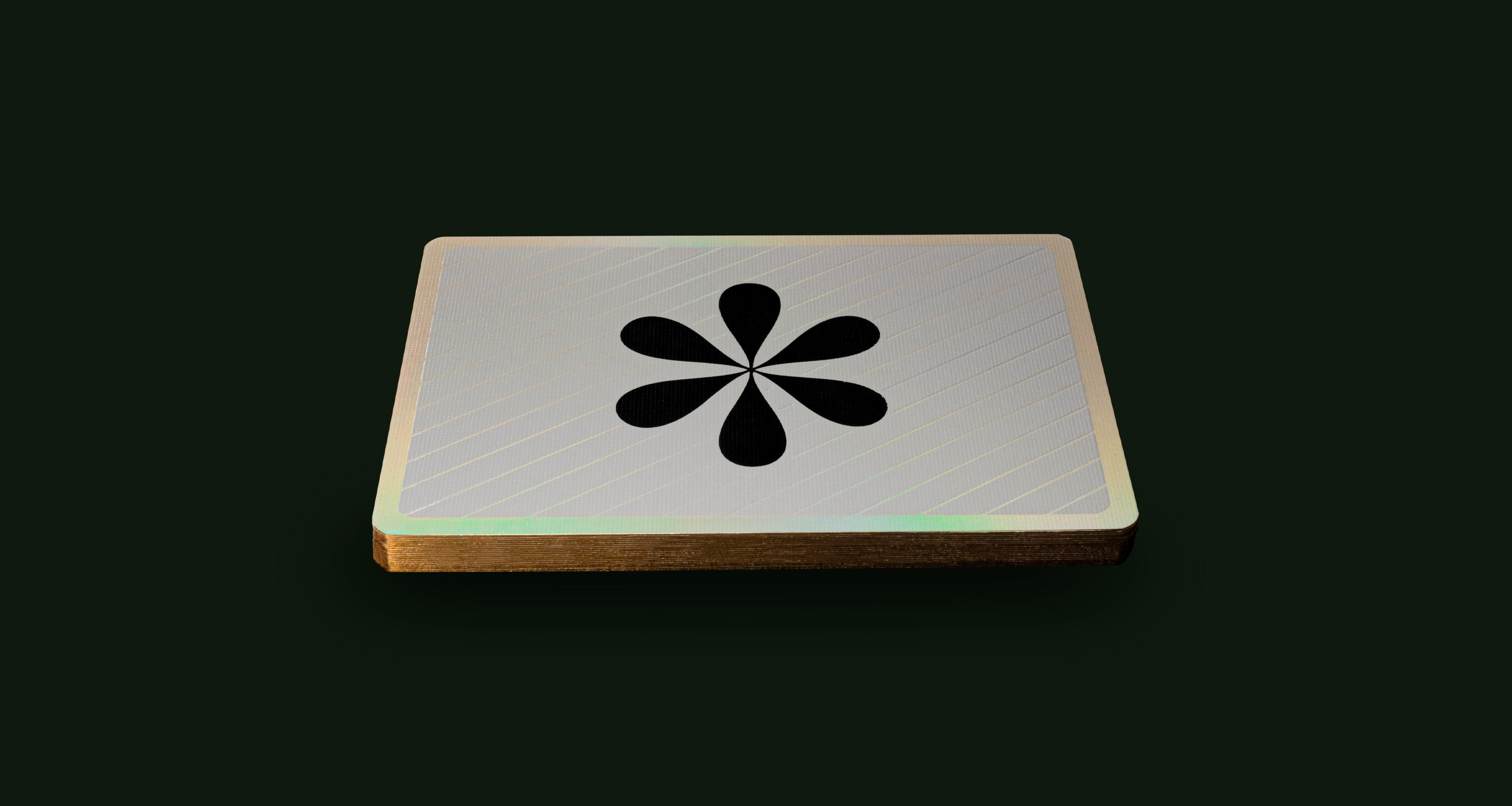 A playing card back floating on a black background