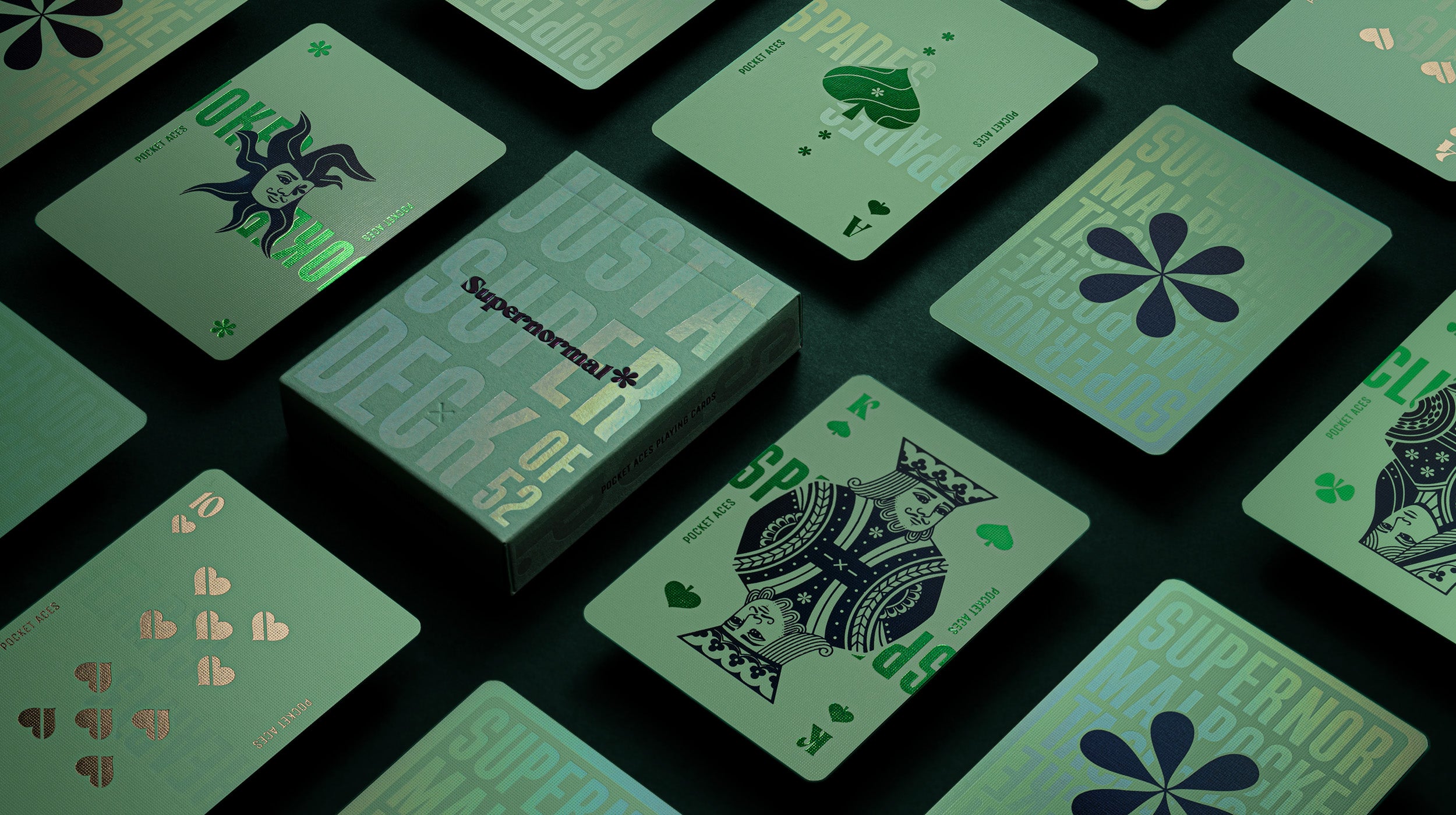 A photo of a green deck of cards on a table