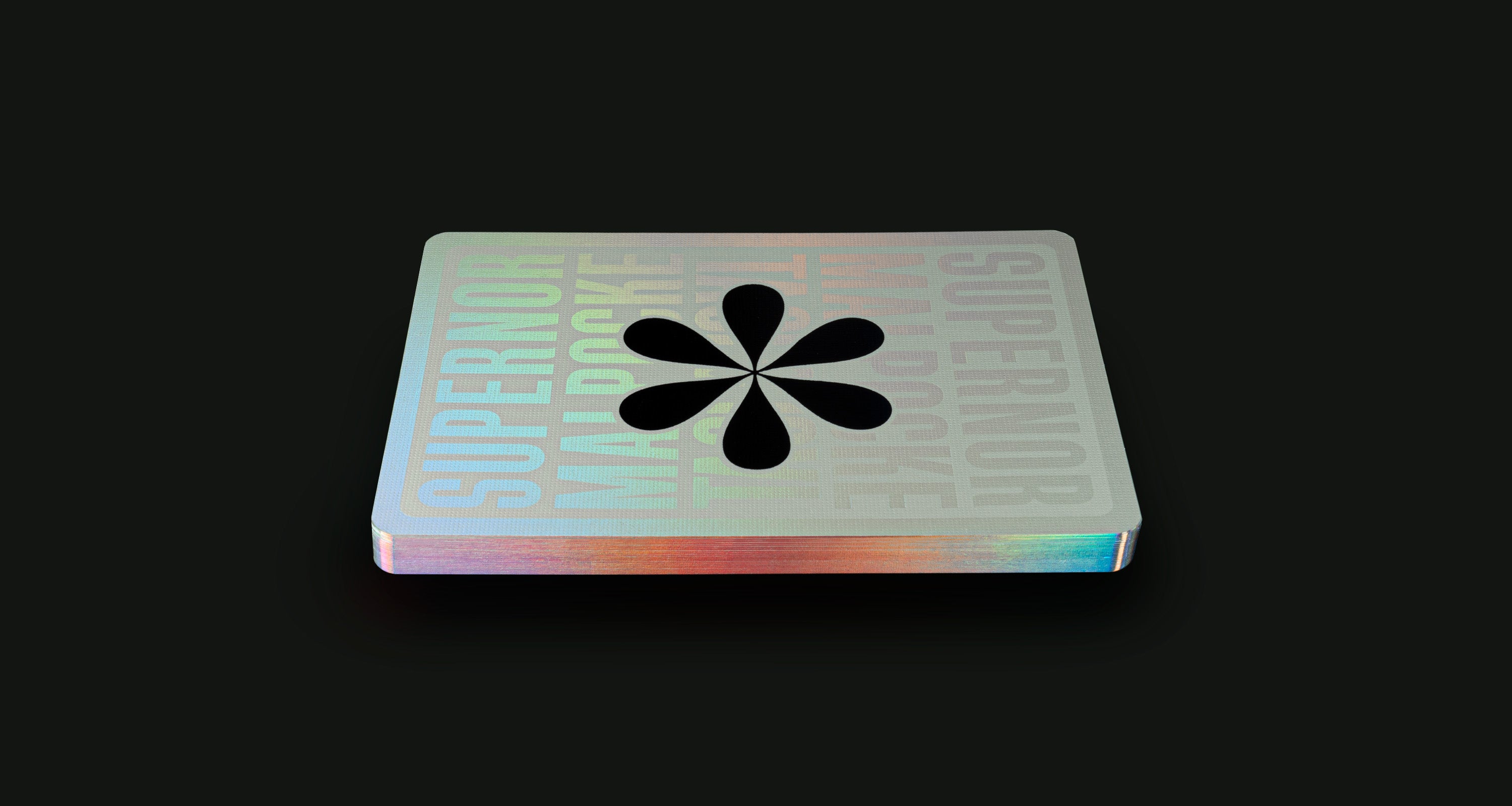 A playing card back floating on a black background