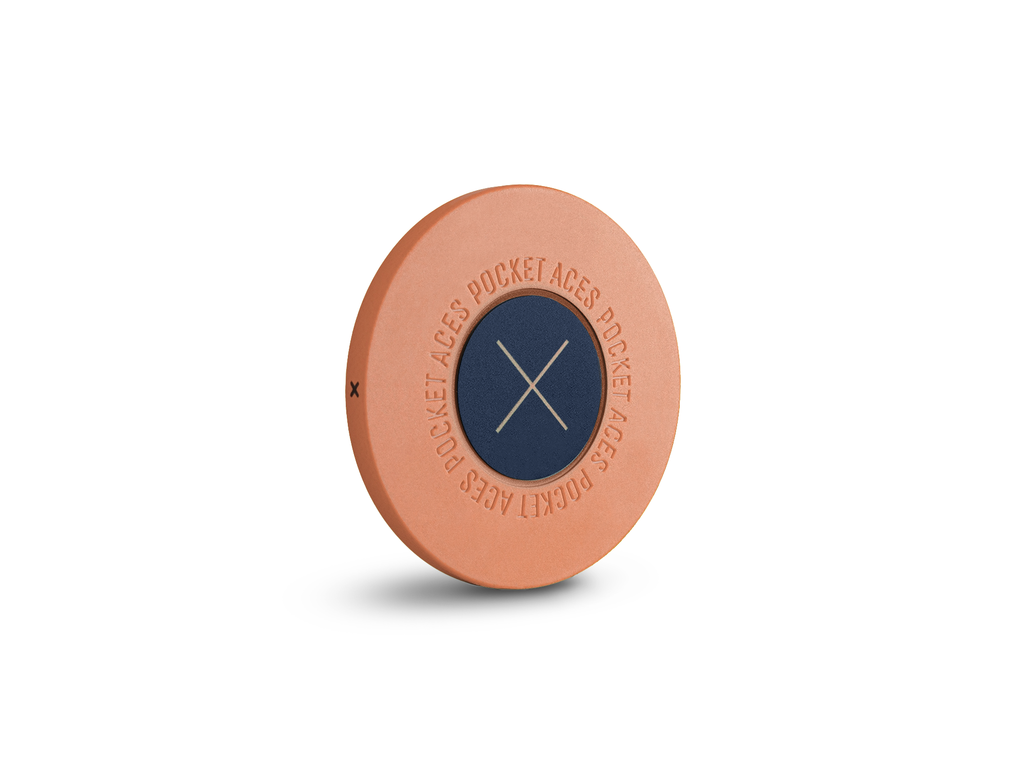 A peach colored poker chip standing on it's edge