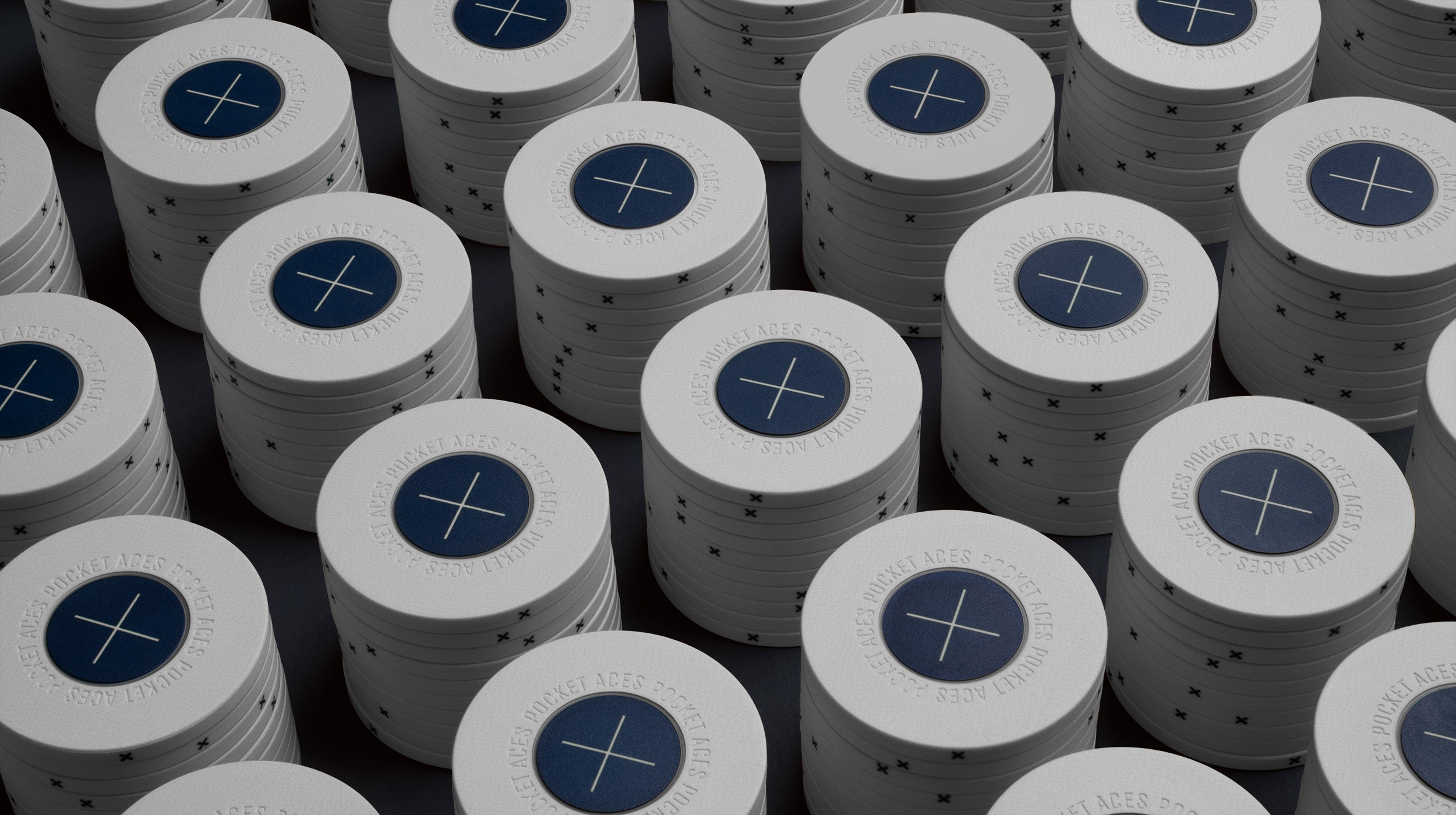 Rows of bone colored poker chips on a table
