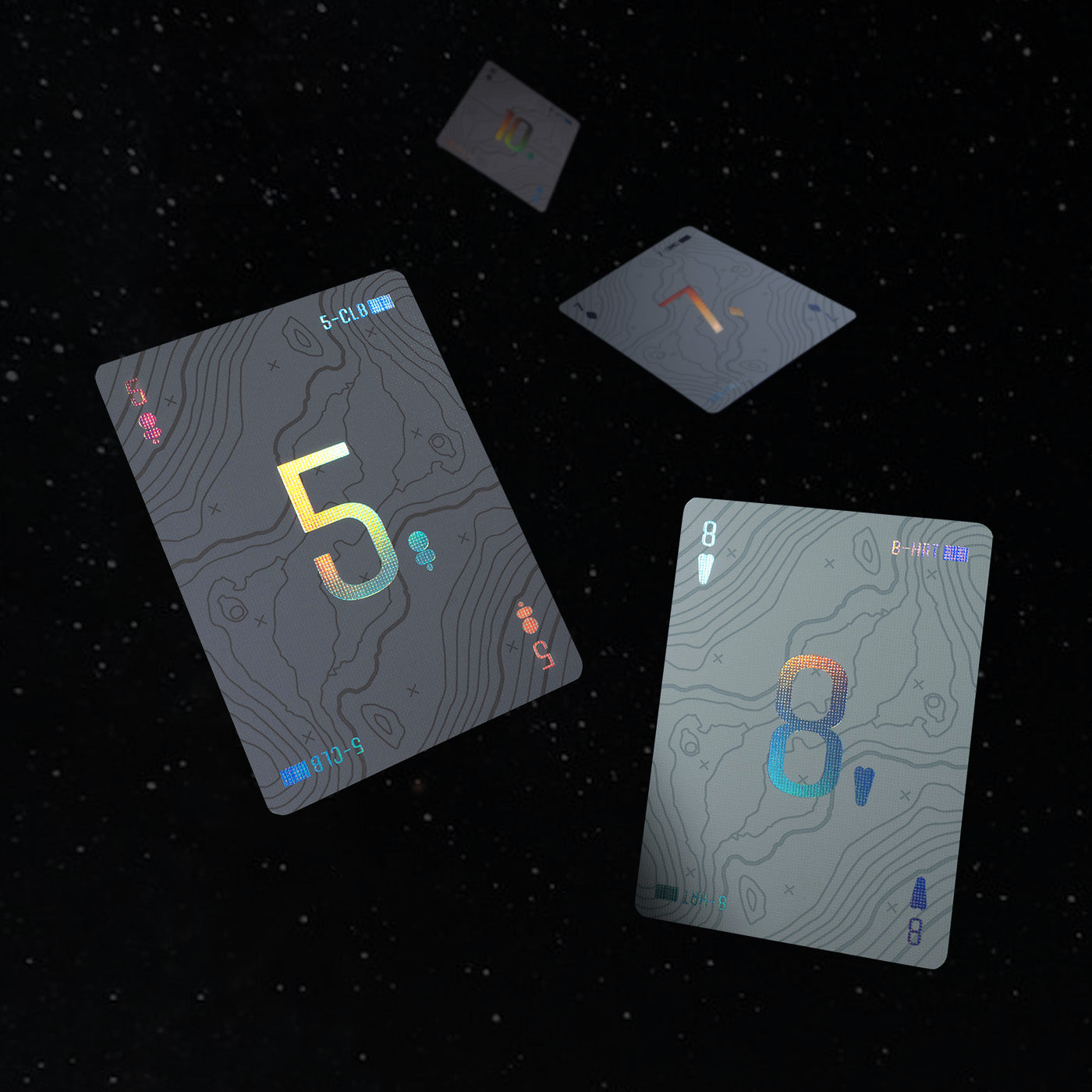 Four playing cards floating in space