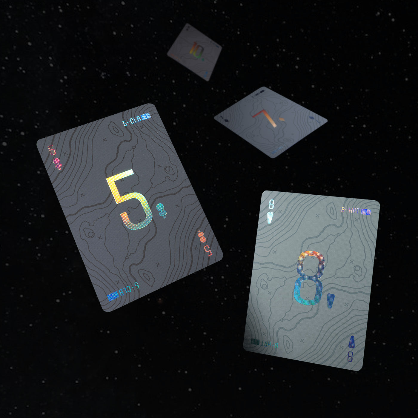 Four playing cards floating in space