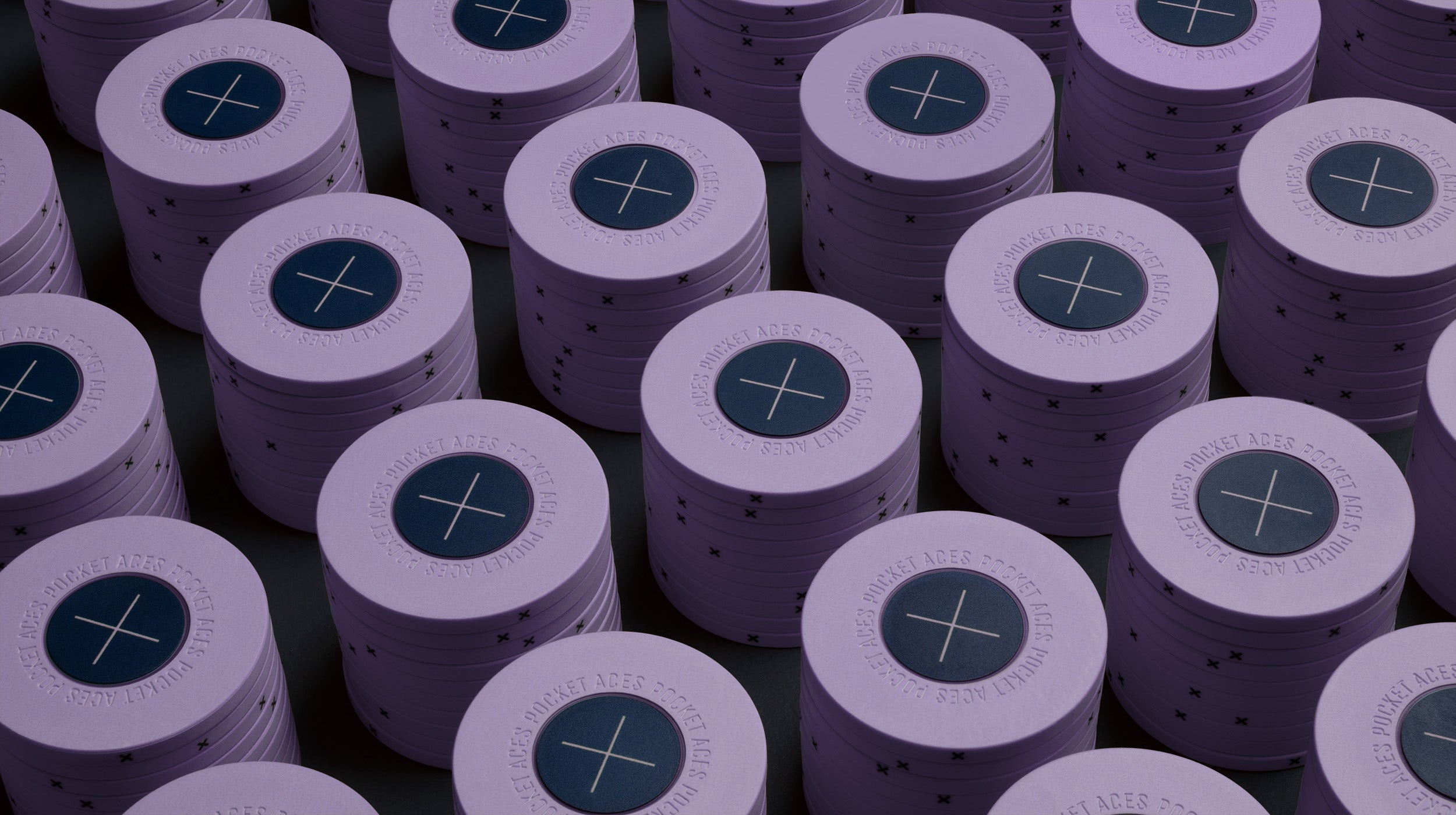 Rows of lilac colored poker chips on a table