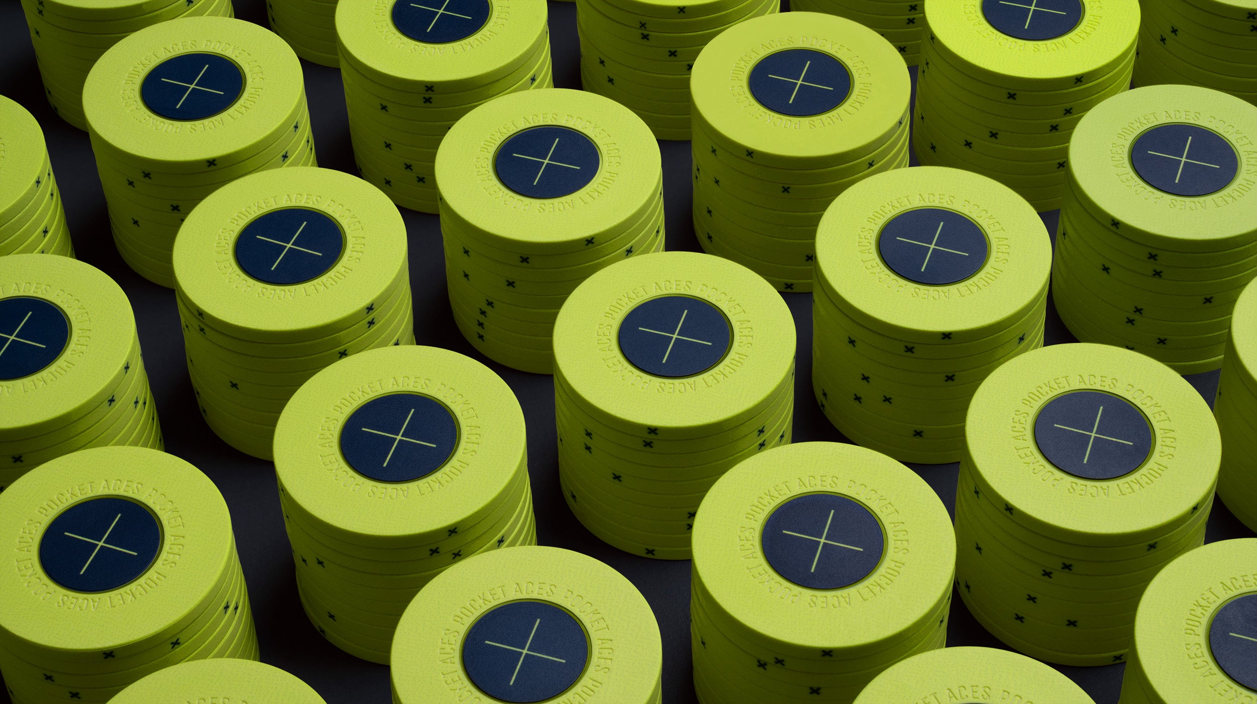 Rows of lime colored poker chips on a table