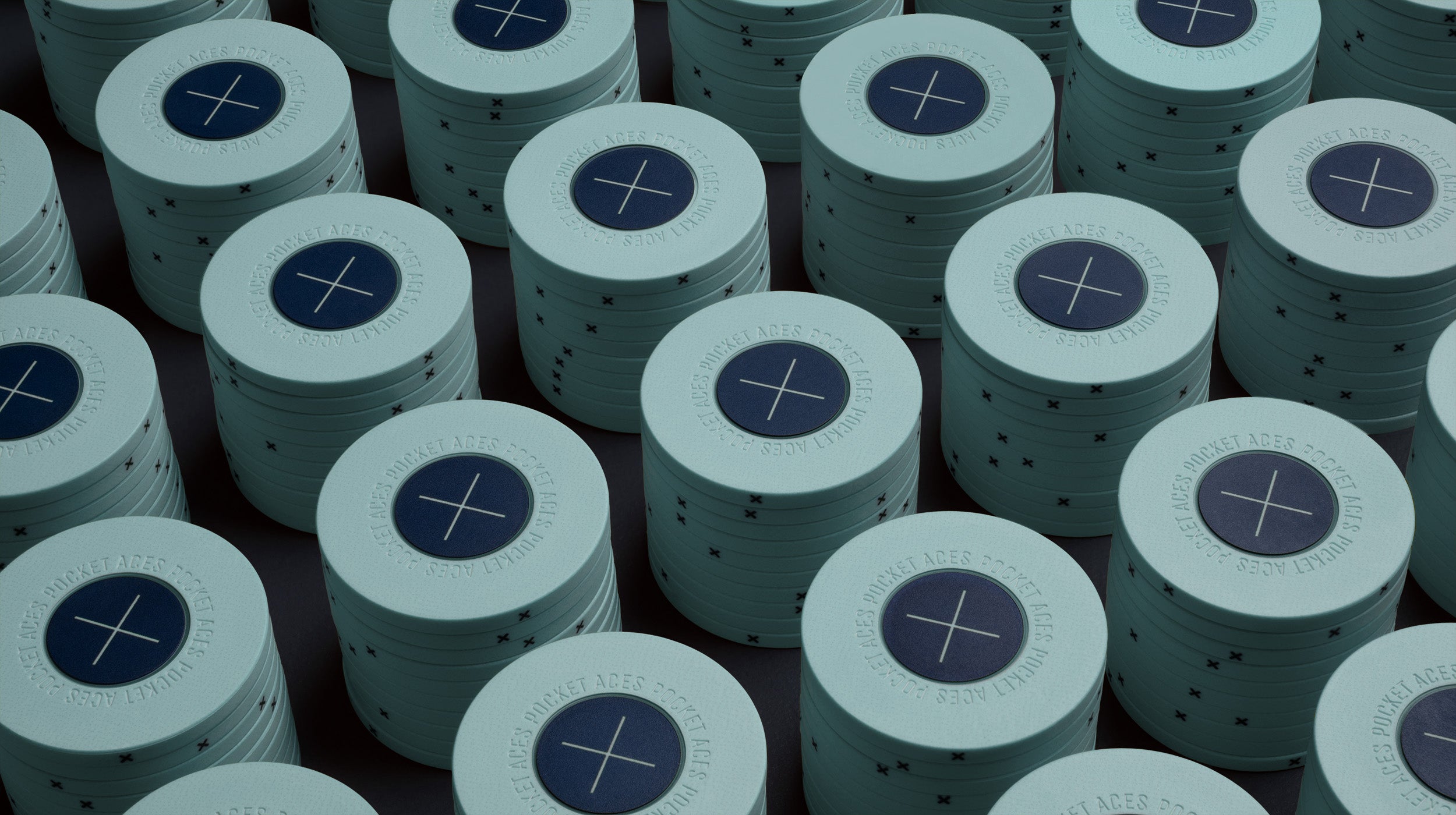 Rows of mist colored poker chips on a table