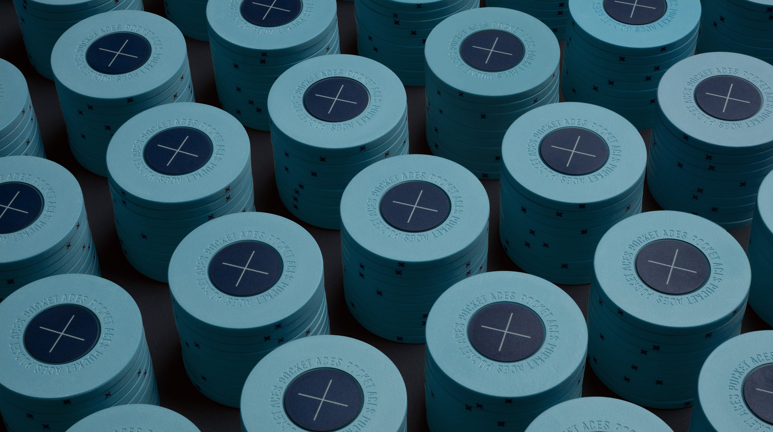 Rows of sky colored poker chips on a table